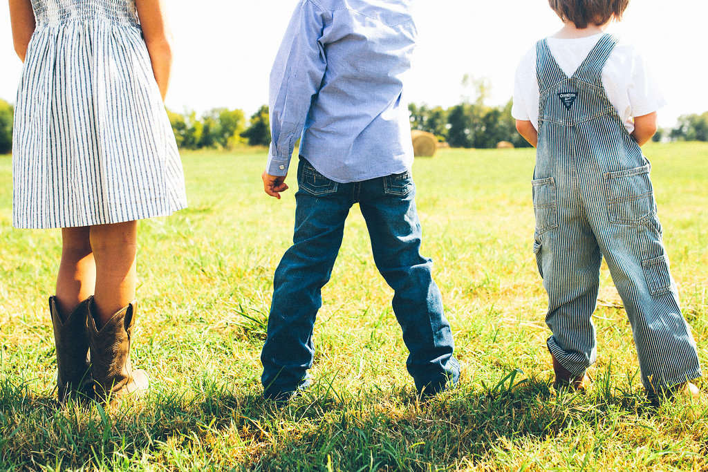 Kids standing in a pasture