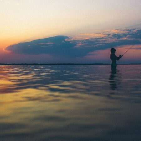 kid fishing in a lake