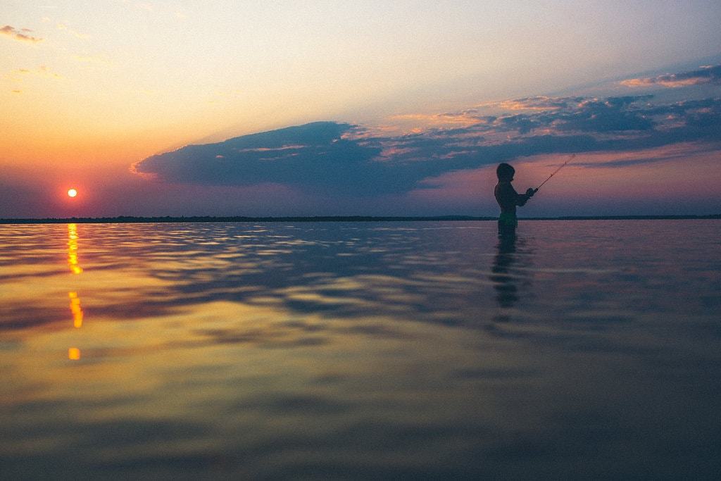 kid fishing in a lake
