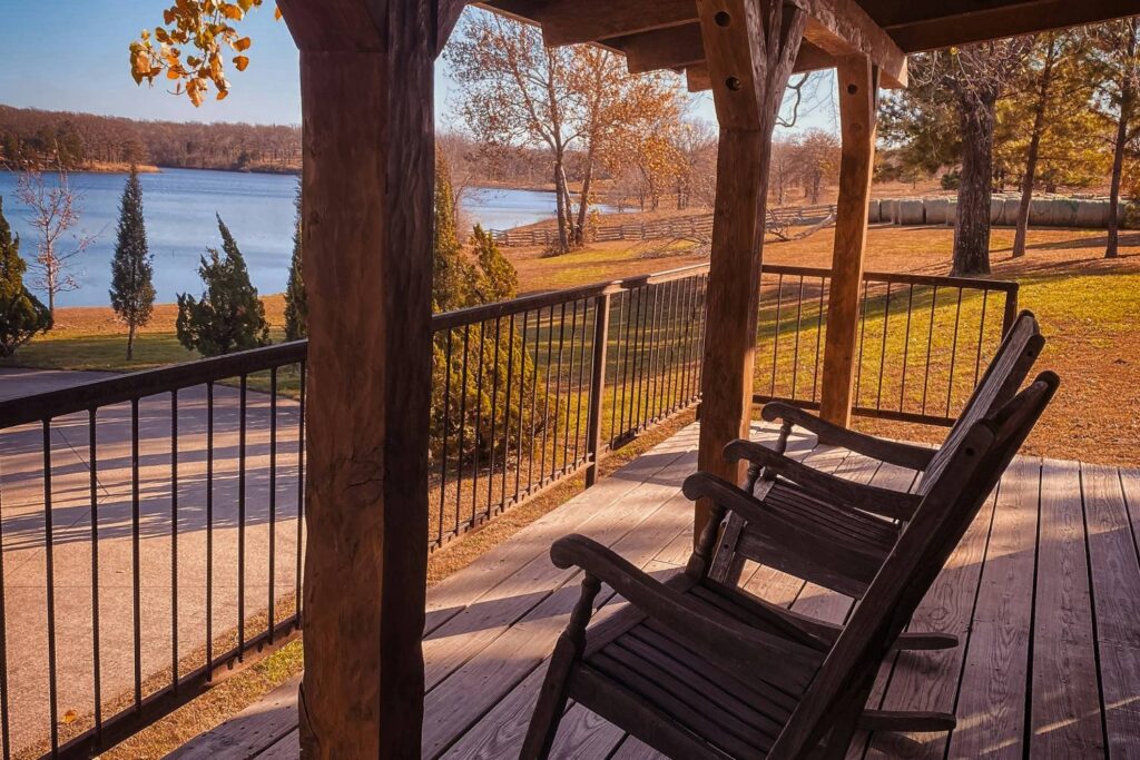 porch on a lake with rocking chairs